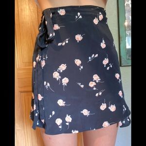 Wrap mini skirt with flower decorations